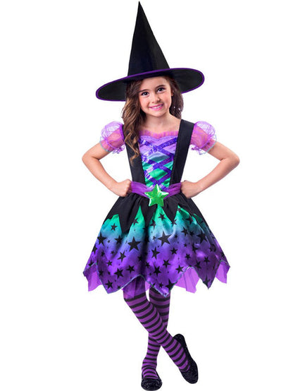 Toddler wearing a purple and black Spell Casting Cutie witch costume with a matching pointed hat outdoors.
