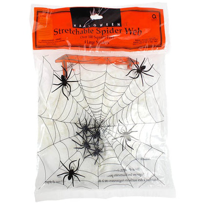 White stretchable synthetic spider web draped across a dark wooden doorframe with four small black plastic spiders embedded in the strands.