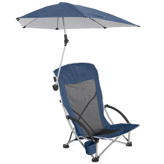 Low-profile blue folding Sport-Brella beach chair with breathable mesh back, padded armrest cup holder, and attached UPF 50+ shade umbrella set up on sunny ocean sand.