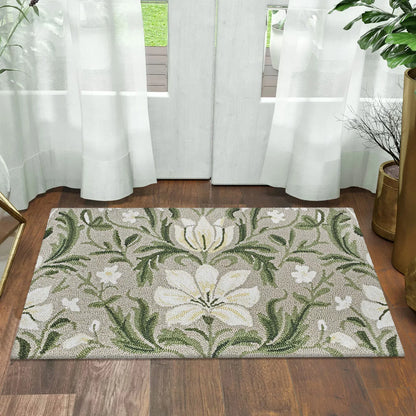Top-down view of the colourful hand-hooked spring accent rug with textured floral motifs on a light hardwood entryway floor.