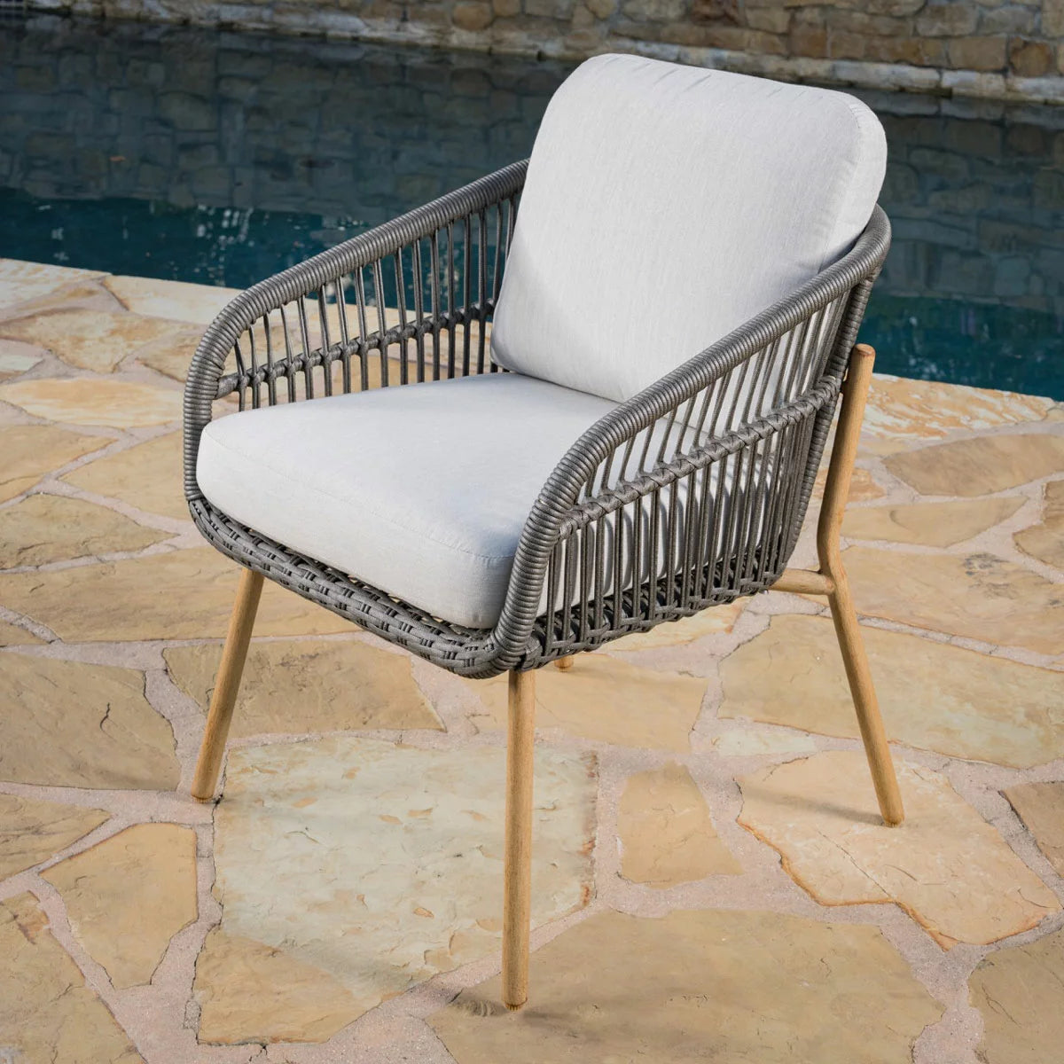 SunVilla Charme 3-Piece Bistro Set featuring honey oak finish chairs and a Permastone round table on a clean patio surface.
