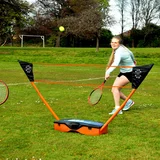 Complete Sure Shot 3-in-1 sports set set up on a green garden lawn showing the adjustable net, tennis rackets, badminton rackets, shuttles, and volleyball neatly laid out beside the blue base trunk.