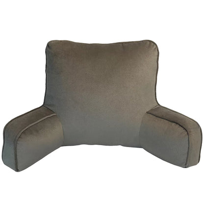 Textured faux suede backrest pillow with padded arms resting upright on a neatly made bed.