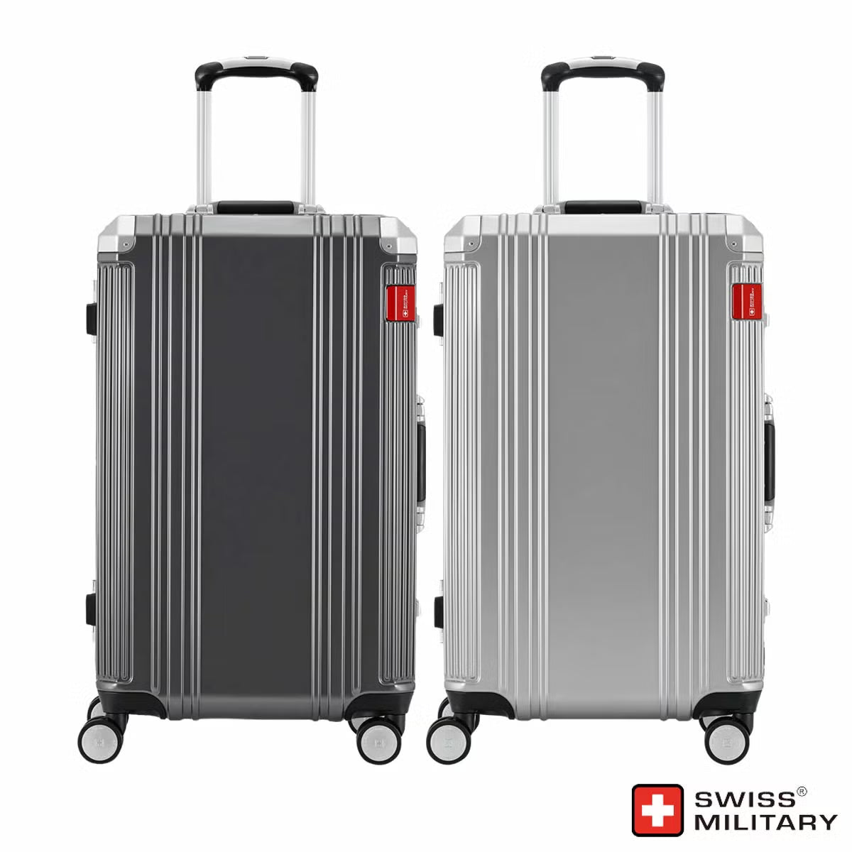 Angle view of the silver and dark grey Swiss Military 63.5cm hardside suitcase showing its aluminium edge frame and double urethane wheels on a light surface.