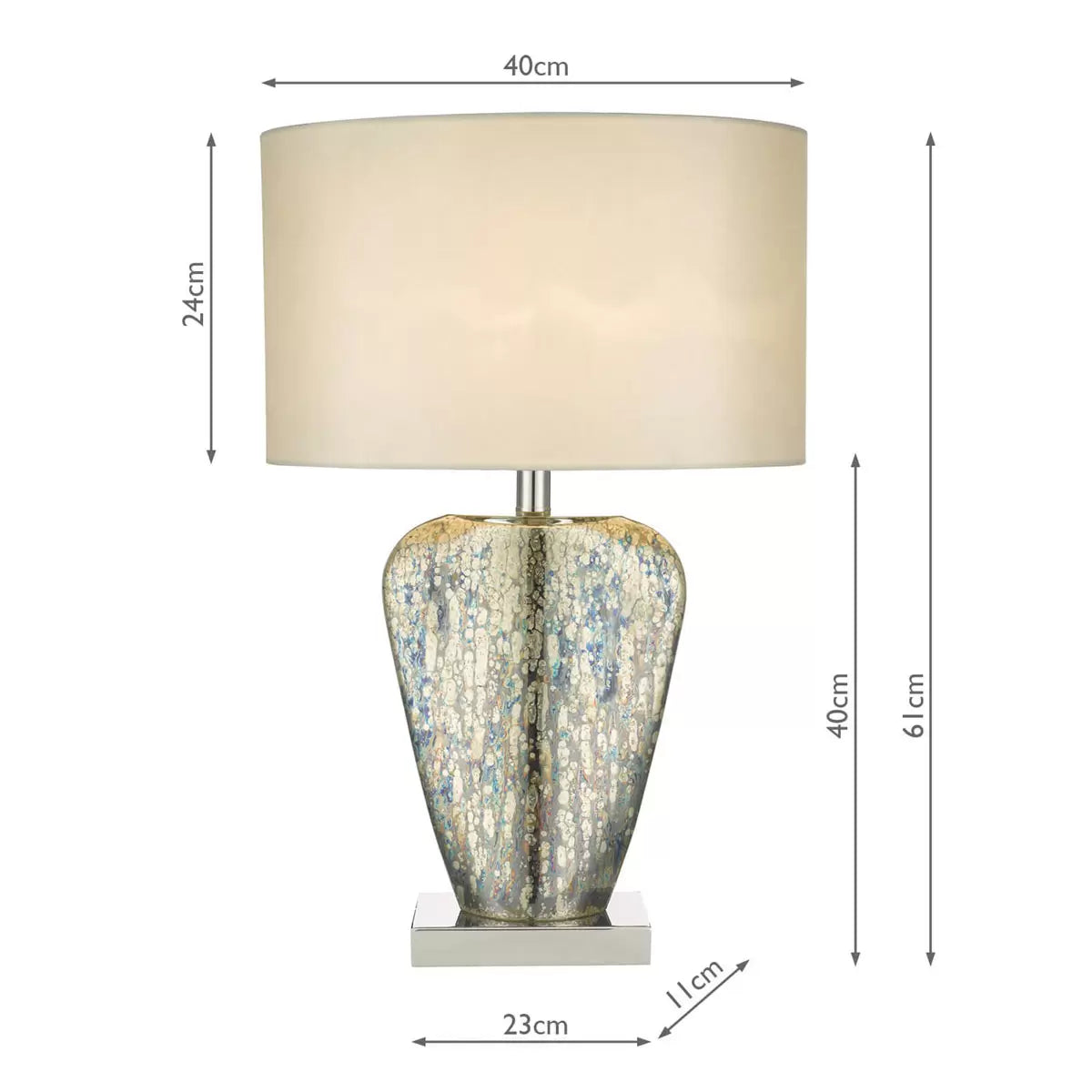 A close-up profile shot of the Syracuse table lamp showcasing its reflective, antique silver-and-gold mercury glass base and textured cream faux silk shade set against a neutral, wood-paneled wall.