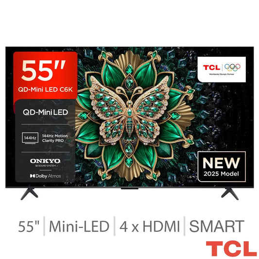 Front angle shot of the black TCL 55C6K 55 Inch Mini LED Smart TV mounted on a light gray wall in a modern living room showing vibrant color contrast.