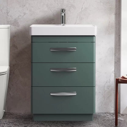 Front angle view of the Tavistock Curve 60cm floor mounted vanity unit featuring three smooth soft-close drawers with curved chrome handles and a deep white ceramic basin integrated into a modern bathroom setting.