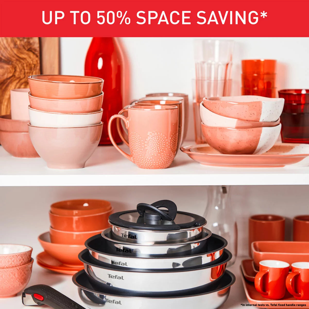 A 13-piece Tefal Ingenio Emotion stainless steel cookware set neatly stacked in a cupboard, demonstrating space-saving convenience.