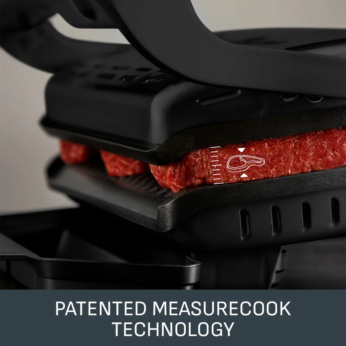 Tefal GC7178G1 OptiGrill+ Health Grill in sleek black stainless steel set on a kitchen countertop displaying illuminated cooking indicators and removable angled grill plates.