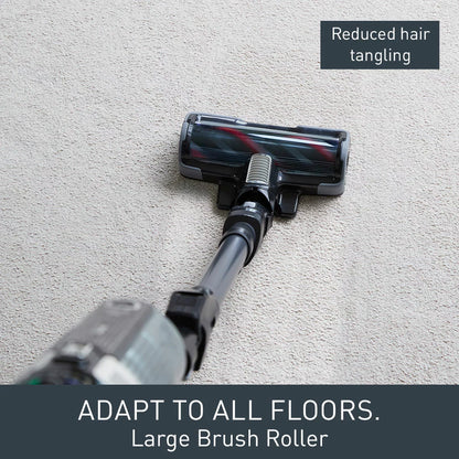 Front view of the Black & Grey Tefal X-Force Flex cordless stick vacuum mounted on its wall base with included pet accessories nearby.