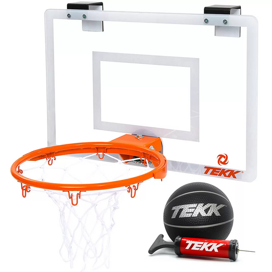 Close-up angled shot of the transparent Tekk Pro Mini Basketball Hoop mounted over a white door, showing the thick black foam backing pads and the bright orange steel breakaway spring rim.