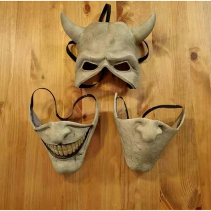 Front view of the light grey Graber horror film cosplay mask showing realistic latex texturing, dark eye cutouts, and elastic headband.