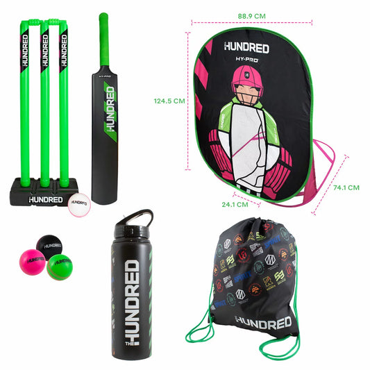 Official black and bright green The Hundred junior cricket set featuring a size 3 bat, pop-up wicket keeper frame, windballs, aluminium water bottle, and gym bag arranged on grass.