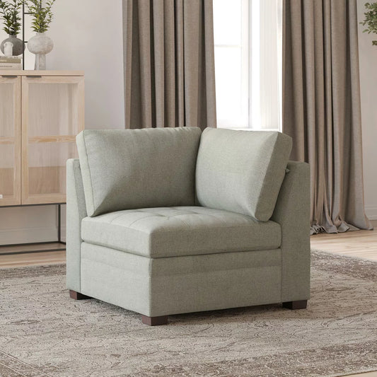 Thomasville Tisdale beige fabric modular corner chair with deep plush cushioning set in a bright contemporary living room setting.