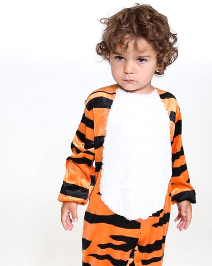 Front view of the plush Tiny Tiger baby jumpsuit with striped hood, faux fur trim, and matching paw booties against a neutral background.