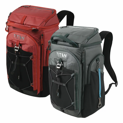 Three-quarter view of the charcoal grey Titan 26 Can Backpack Cooler standing upright on a stone bench, showcasing its padded mesh shoulder straps and side pockets.