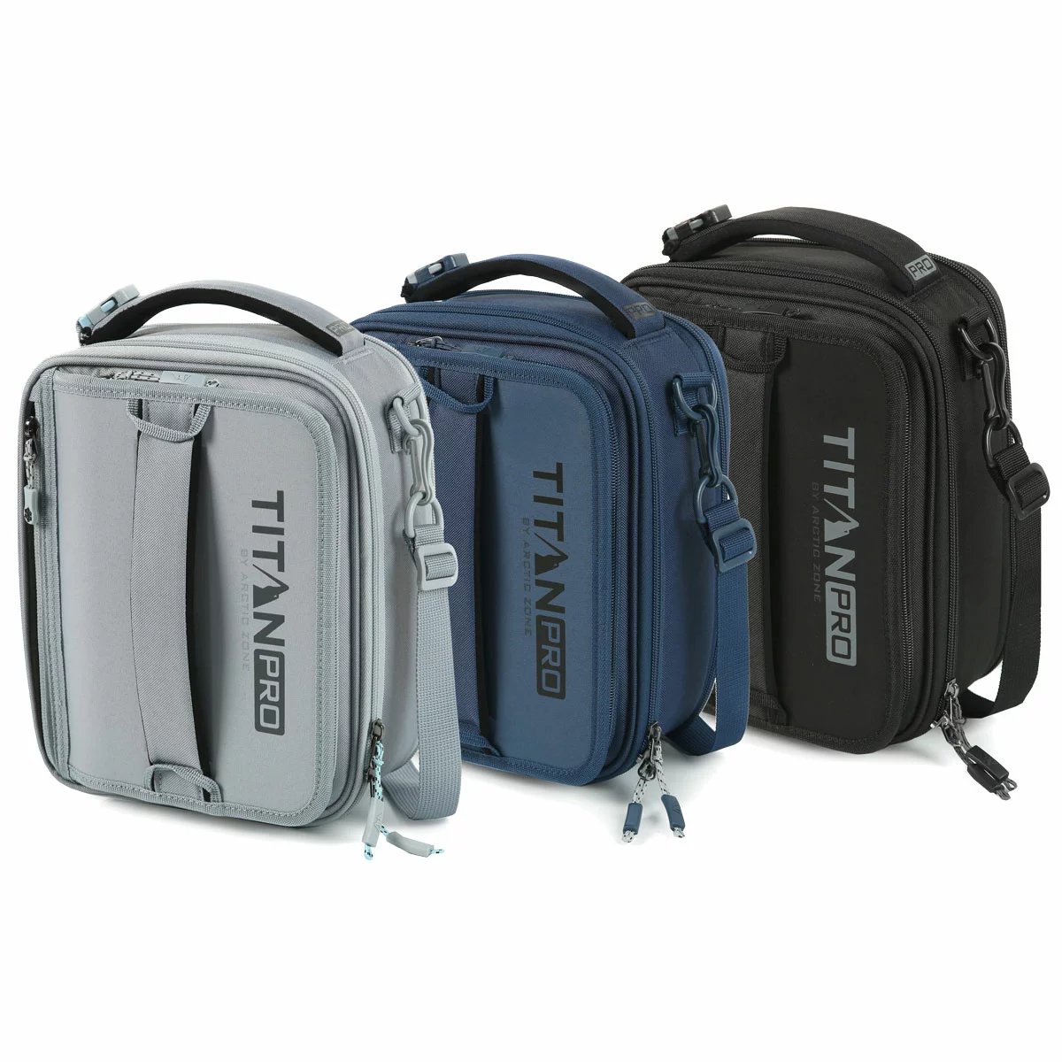 Three-quarter view of the expandable blue Titan Pro Lunch Box in its expanded state on a stone kitchen island, with the bento box and ice walls placed neatly beside it.