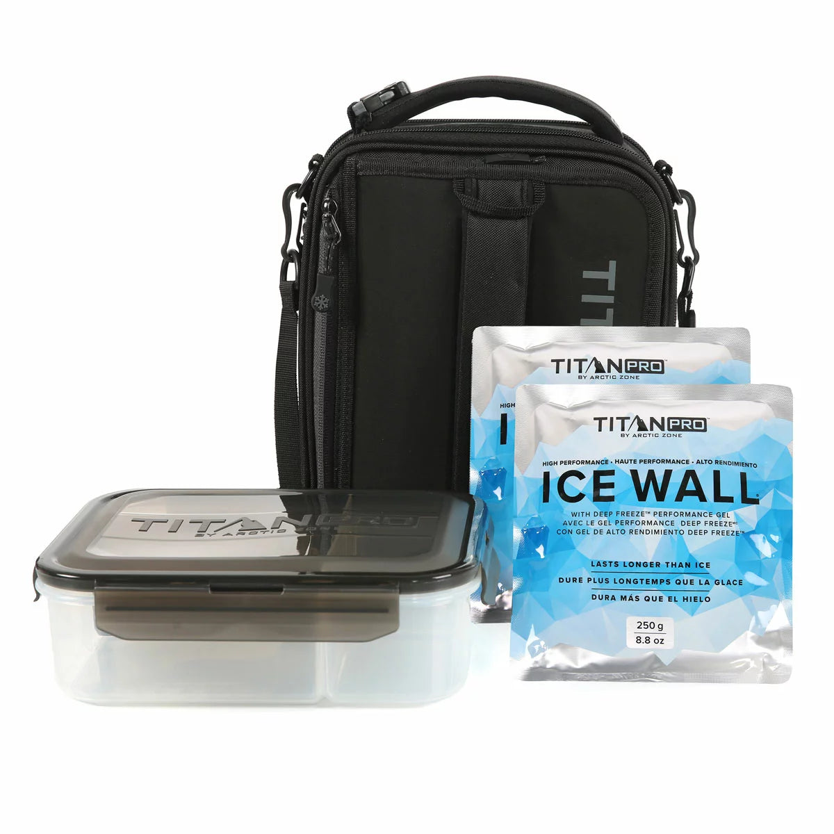Three-quarter view of the expandable blue Titan Pro Lunch Box in its expanded state on a stone kitchen island, with the bento box and ice walls placed neatly beside it.
