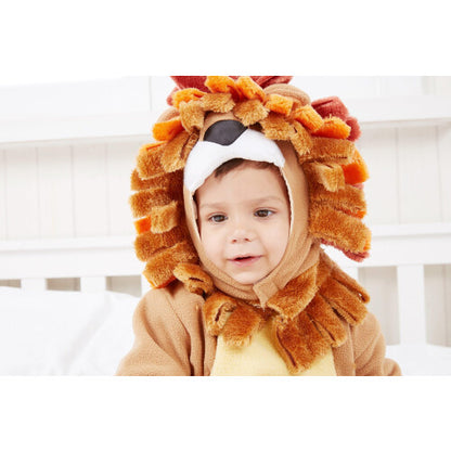 Front view of a toddler wearing a golden-brown plush lion costume with a plush mane hood, matching booties, and holding a striped plush zebra toy.
