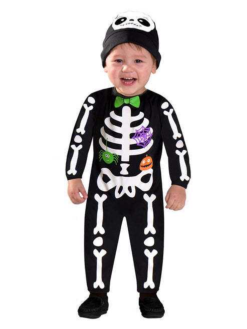 Front view of a toddler wearing a black 100% polyester Mini Bones jumpsuit with white printed skeleton bones and a matching black hat against a plain background.