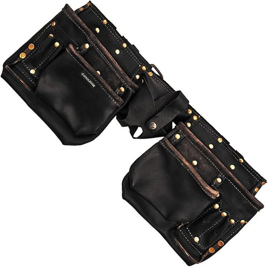 Front view of the black oil-tanned Toolzone 12-pocket genuine leather double pouch tool belt with reinforced steel rivets resting on a wooden workbench.