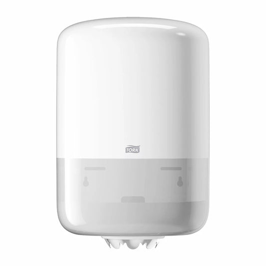 White plastic Tork M2 Centrefeed Hand Towel Dispenser mounted on a clean kitchen wall, showing the bottom paper exit nozzle.