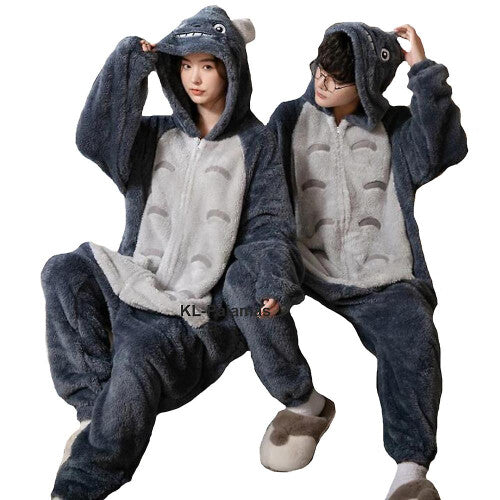Front view of a grey and white plush Totoro adult onesie jumpsuit featuring an attached character hood and side pockets on a neutral studio background.
