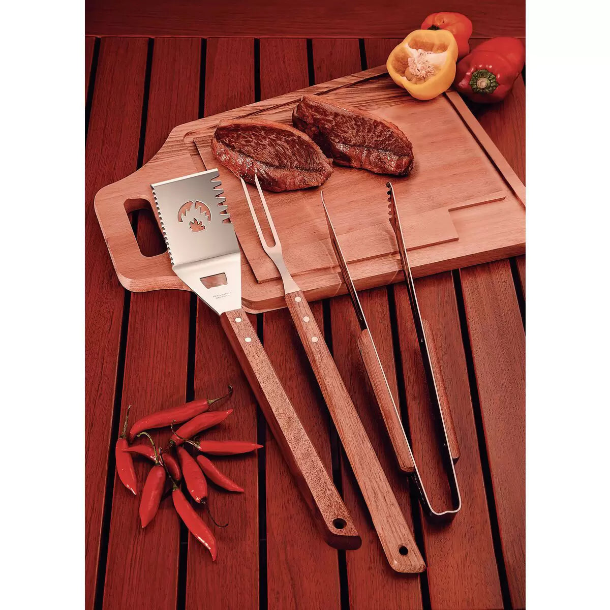 A 3-piece Tramontina BBQ tool set featuring stainless steel utensils with ergonomic, heat-resistant hardwood handles on a clean background.