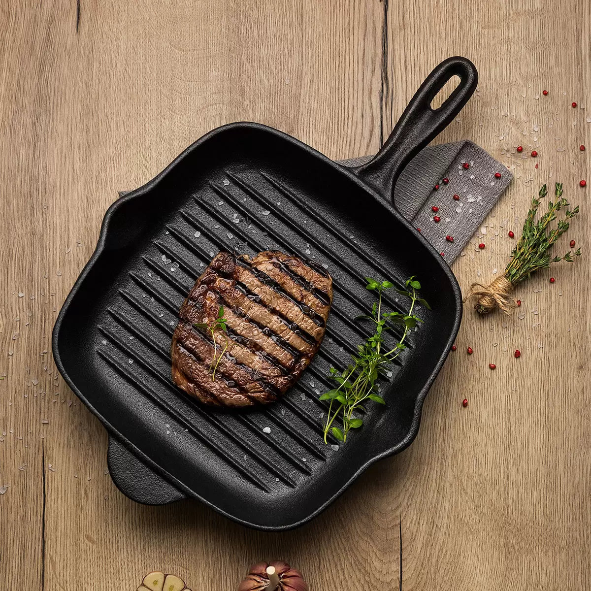 Tramontina 27cm cast iron square griddle pan for grilling, searing, and even heat cooking.