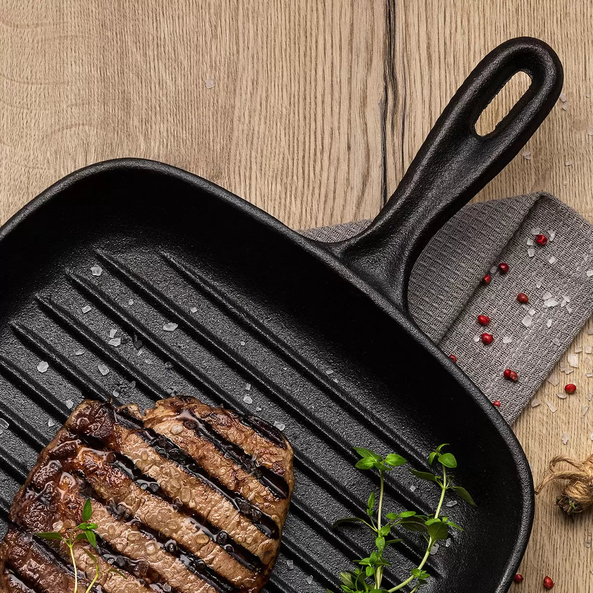 Tramontina Cast Iron Square Griddle Pan 27cm with superior heat retention and even heat distribution, ideal for grilling steaks, burgers, vegetables, and achieving perfect sear marks on indoor and outdoor meals.