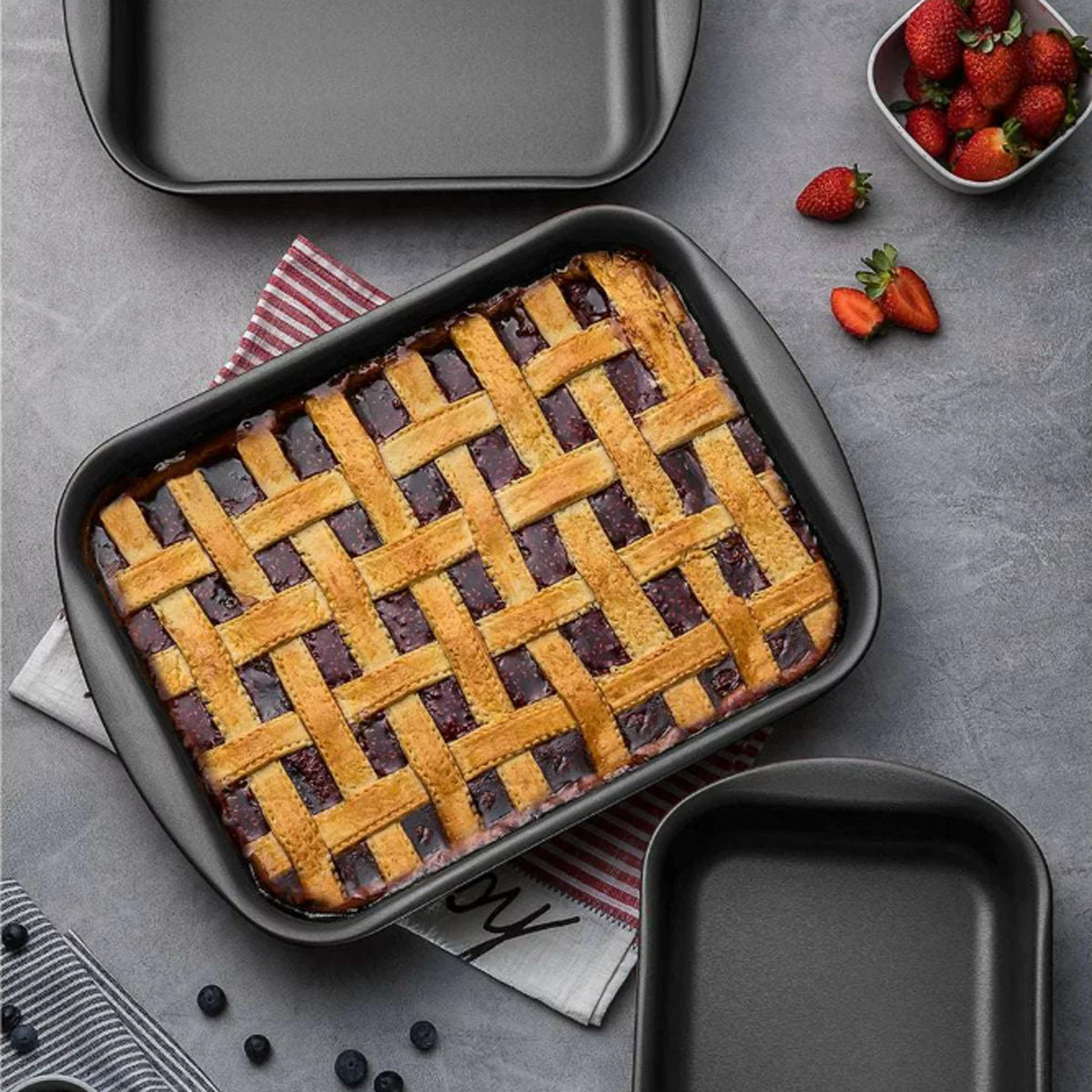 Tramontina 3 piece roasting pan set with durable oven-safe construction for roasting meats, vegetables, and family meals.