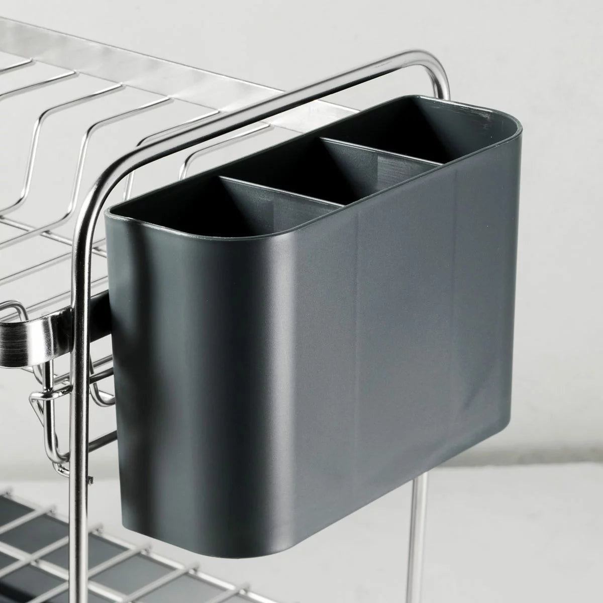 Tramontina 2-tier stainless steel dish rack neatly organised on a modern kitchen countertop.