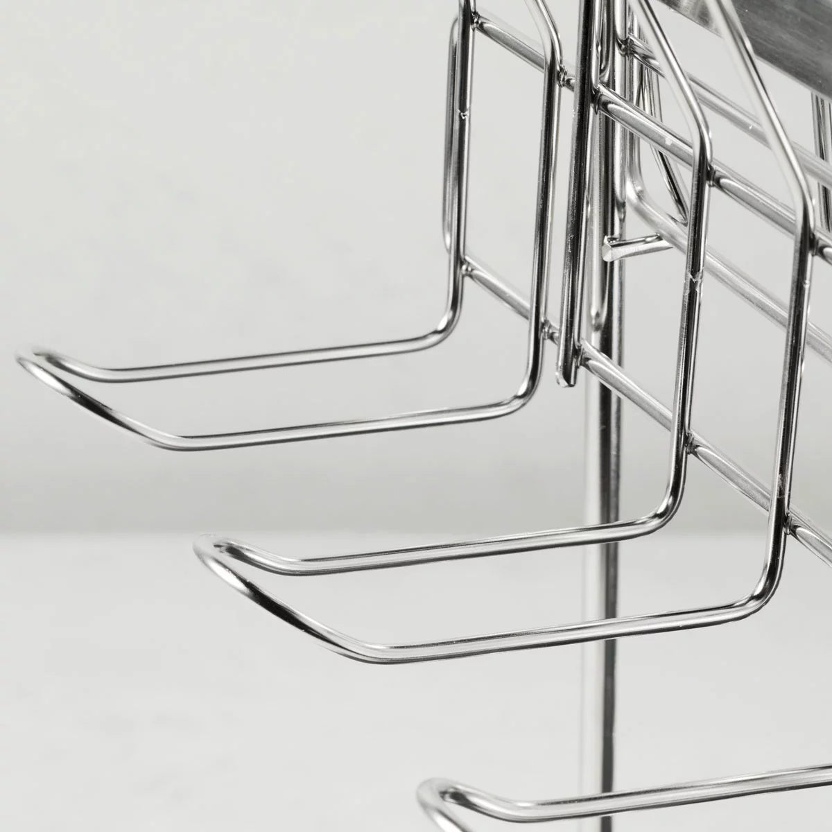 Tramontina 2-tier stainless steel dish rack neatly organised on a modern kitchen countertop.