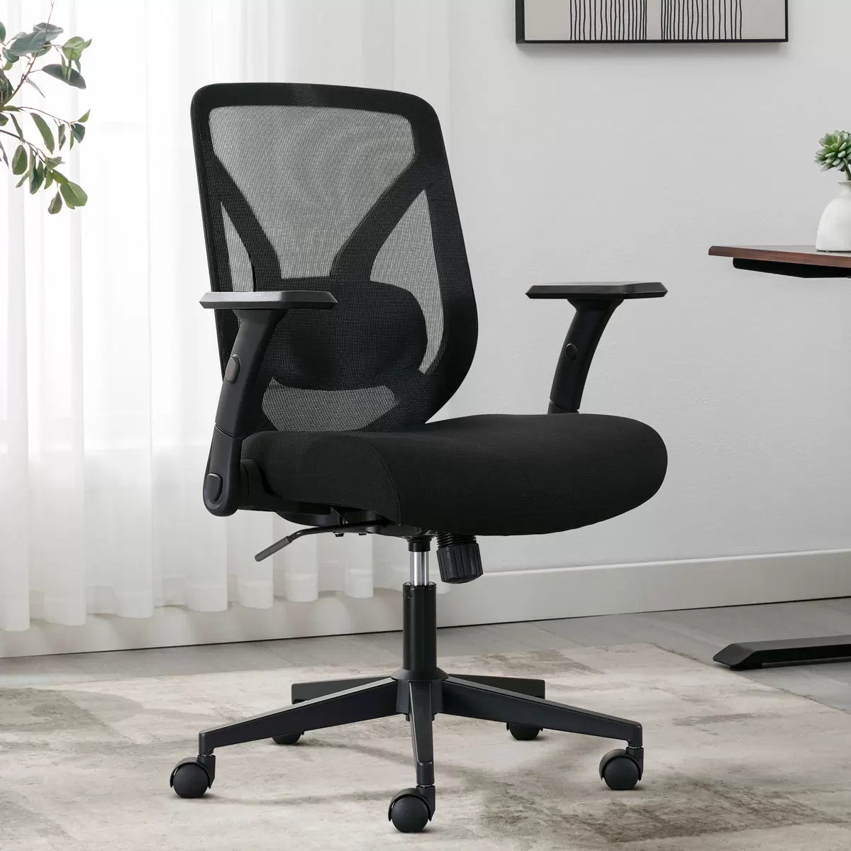 True Innovations mesh office chair with breathable mesh back, flip-up arms, adjustable height, and ergonomic office seating design.
