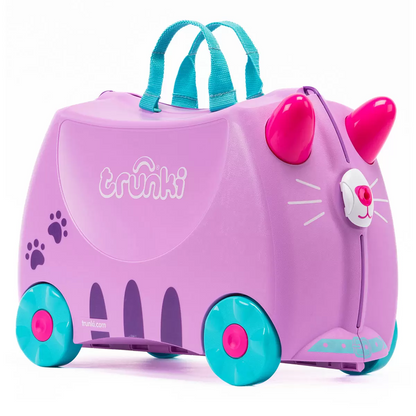 Bright side profile view of a colorful Trunki Ride On Hardside Suitcase showing the horn steering handles, contoured saddle seat, and rolling wheels.