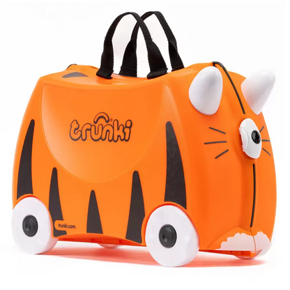 Bright side profile view of a colorful Trunki Ride On Hardside Suitcase showing the horn steering handles, contoured saddle seat, and rolling wheels.
