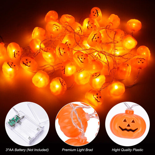 A 5-meter strand of 30 LED 3D pumpkin string lights glowing warmly along an outdoor wooden garden fence.
