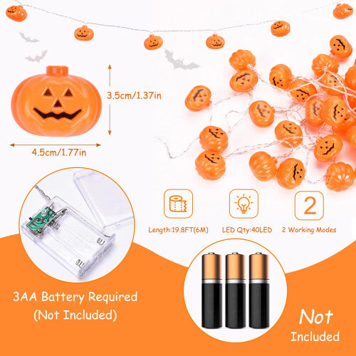 A 5-meter strand of 30 LED 3D pumpkin string lights glowing warmly along an outdoor wooden garden fence.