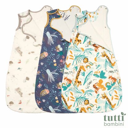 Tutti Bambini white and blue 2.5 Tog bamboo cotton baby sleeping bag displayed flat on a neutral nursery surface.