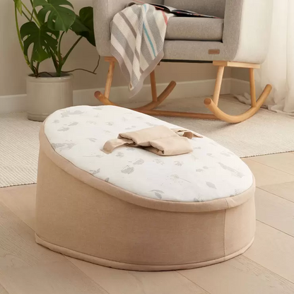 The zip-off top layer being removed from the Tutti Bambini baby beanbag to transition it into a toddler lounge chair.
