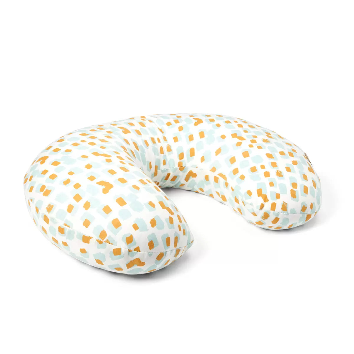 Soft bamboo-cotton Tutti Bambini Run Wild pattern feeding pillow resting on a nursery chair in an arched ergonomic shape.