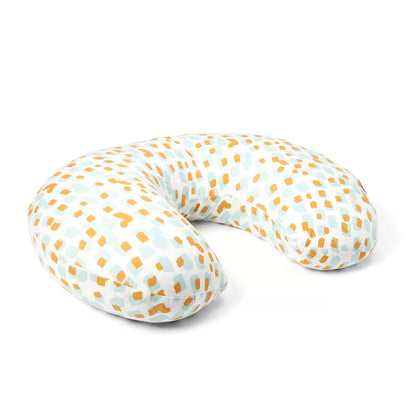 Soft bamboo-cotton Tutti Bambini Run Wild pattern feeding pillow resting on a nursery chair in an arched ergonomic shape.