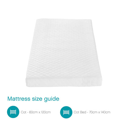 White Tutti Bambini Sprung Cot Mattress with quilted fresh tech fabric cover shown in a modern wooden nursery cot.
