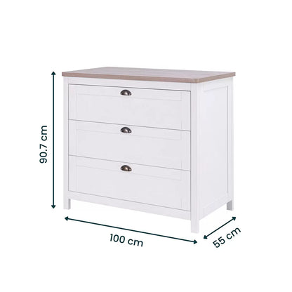 Front view of the white and oak Tutti Bambini Verona changing unit chest with three drawers and traditional brass handles shot in a brightly lit room.