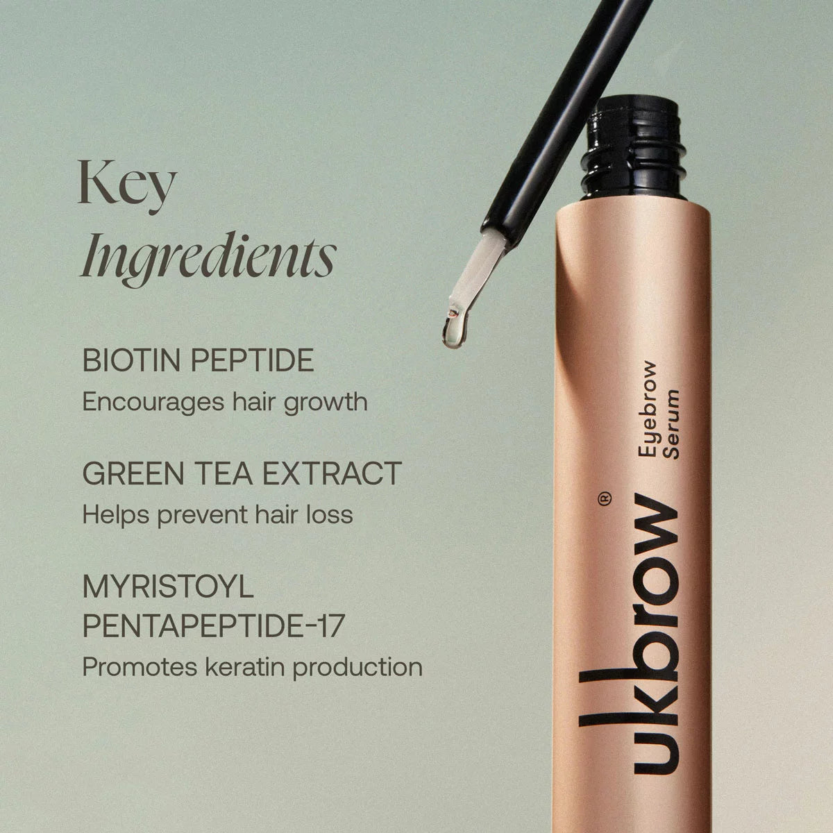 Two sleek tubes of UK Brow Eyebrow Serum with a precision applicator wand resting gently on a polished marble vanity top.