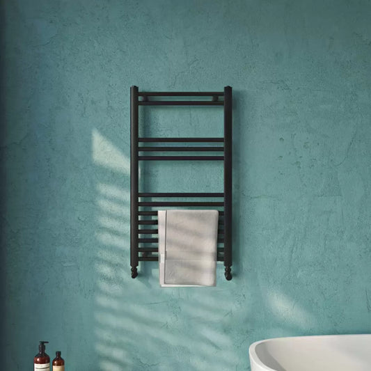 Front view of a chrome UltraHeat Eco Rail towel radiator with 13 horizontal bars mounted on a modern tiled bathroom wall.