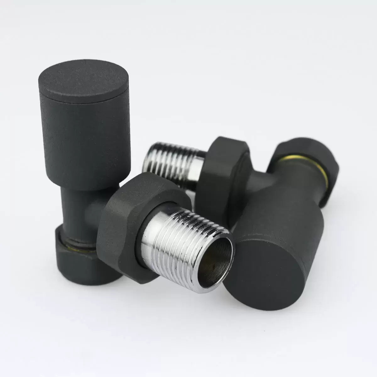 Ultraheat Cylindrical-25 vertical manual angled radiator valve pair in anthracite grey with chrome tail connection point.
