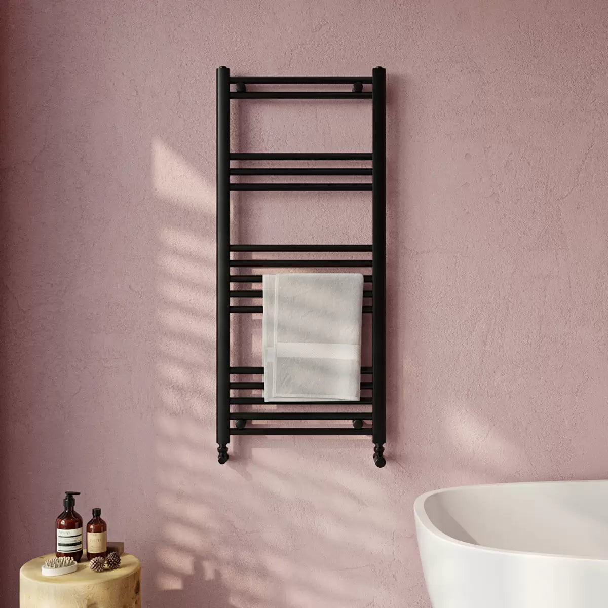 Front view of the Ultraheat Eco Rail 500x1175mm towel radiator with 19 steel bars mounted on a modern tiled bathroom wall.
