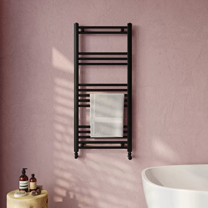 Front view of the Ultraheat Eco Rail 500x1175mm towel radiator with 19 steel bars mounted on a modern tiled bathroom wall.