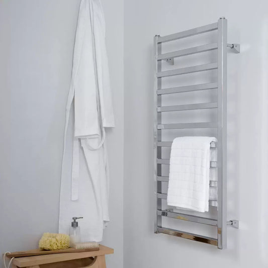 Front view of the Ultraheat Karnak chrome square ladder towel radiator mounted on a dark tiled bathroom wall with a folded grey towel.